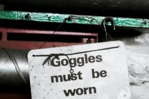 goggle must be worn sign hanging on nail