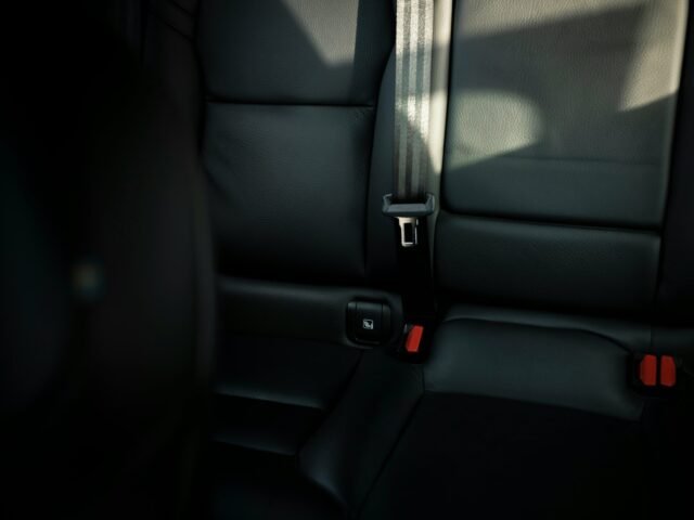 black leather car seat with seat belt scaled