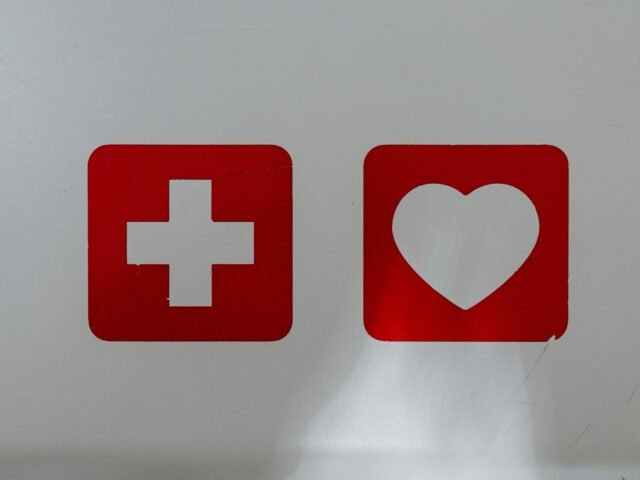 red and white x logo scaled